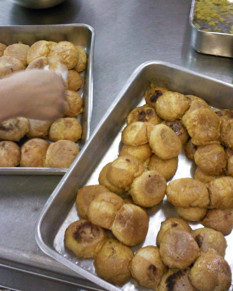 Two members cooking on the griddle in the fire station kitchen — August 2026